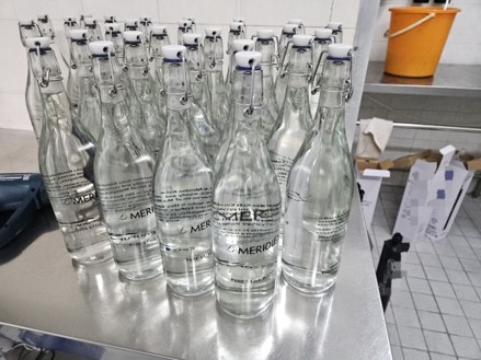 Le Méridien Kota Kinabalu branded glass drinking-water bottles