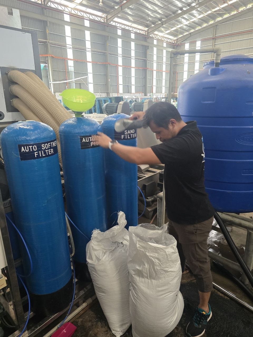 SWFI technician servicing industrial RO pretreatment filters