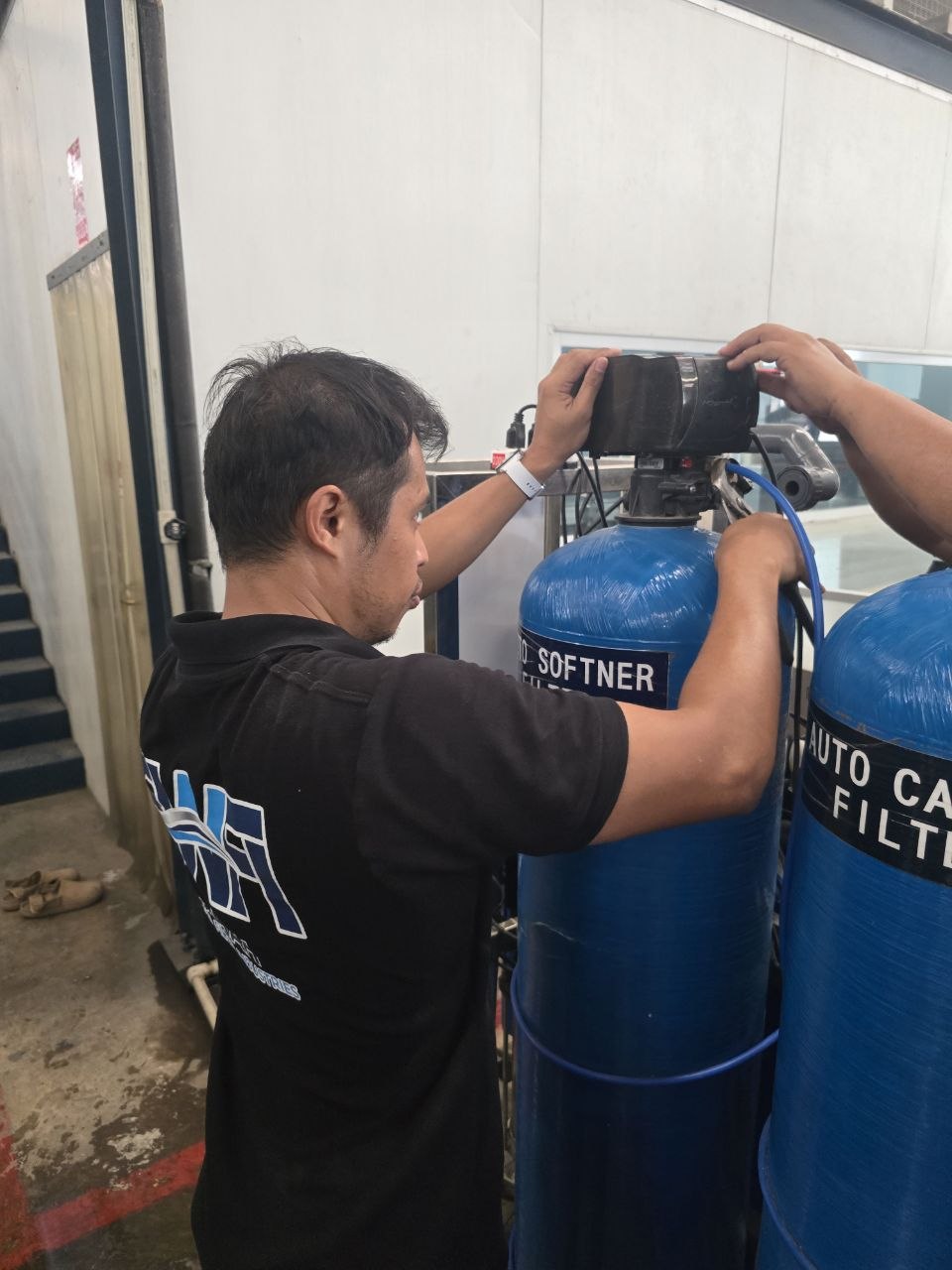SWFI technician servicing automatic softener valve